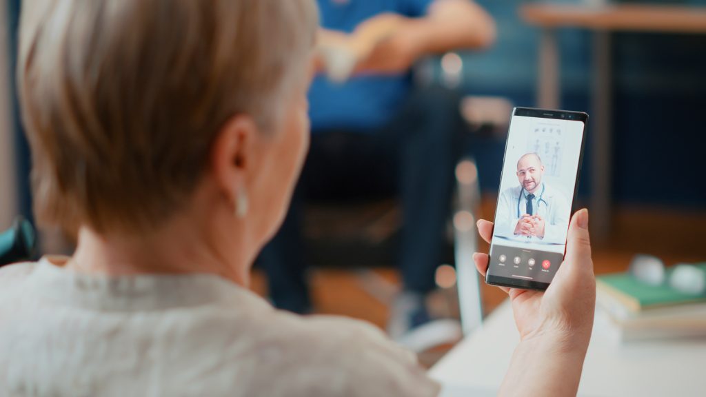 woman-attending-online-consultation-videocall-with-medic-talking-about-health-care-senior-adult-using-online-videoconference-with-doctor-telemedicine-telehealth