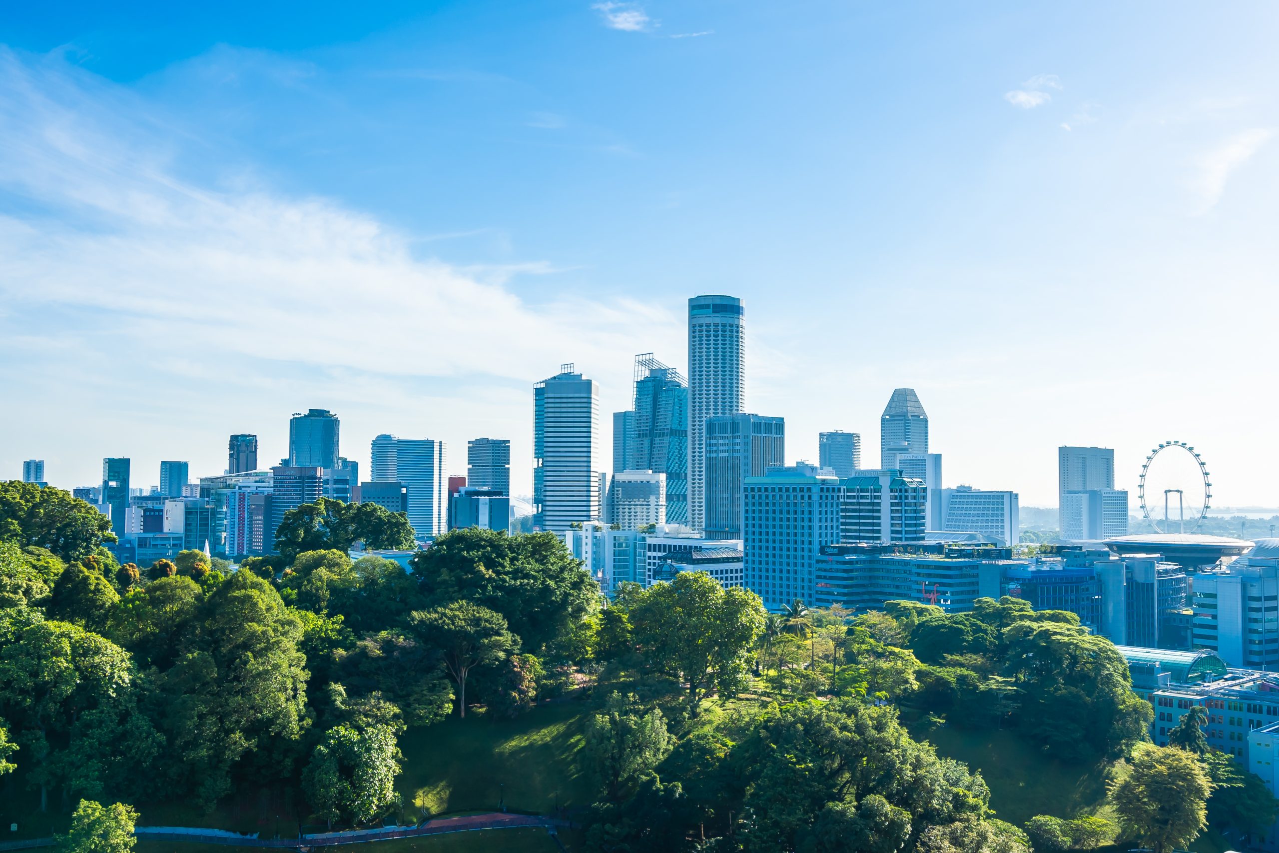 Beautiful architecture building exterior cityscape in Singapore city skyline with white cloud on blue sky