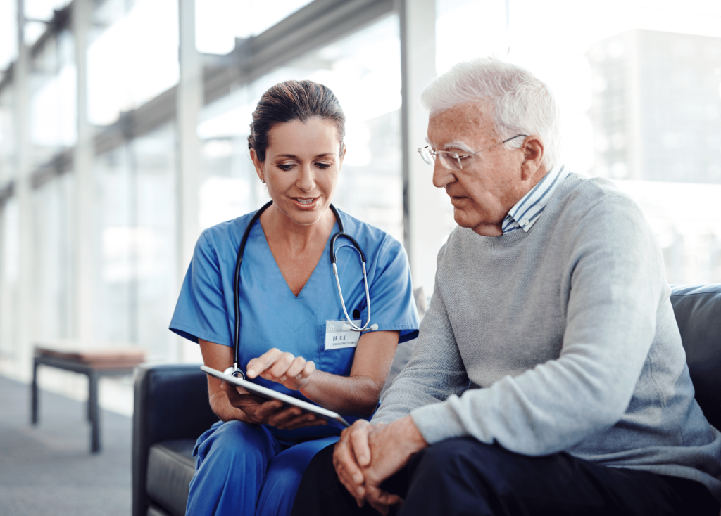 Clinicians showing elderly patient patient portal on tablet device