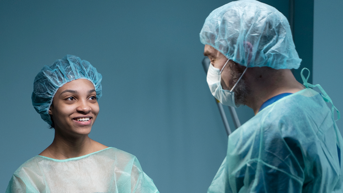 doctor talking to surgery patient